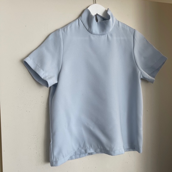 light blue turtleneck shirt